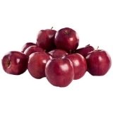 A pile of Red Delicious apples on a white background.