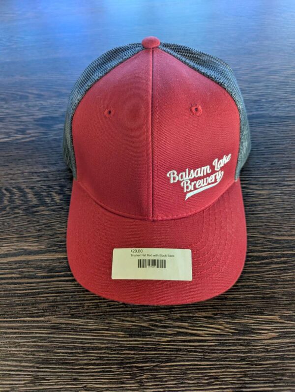 Trucker Hat Red with Black Back featuring "Balsam Lake Brewery" text and priced at $25.00, complete with a black mesh back.