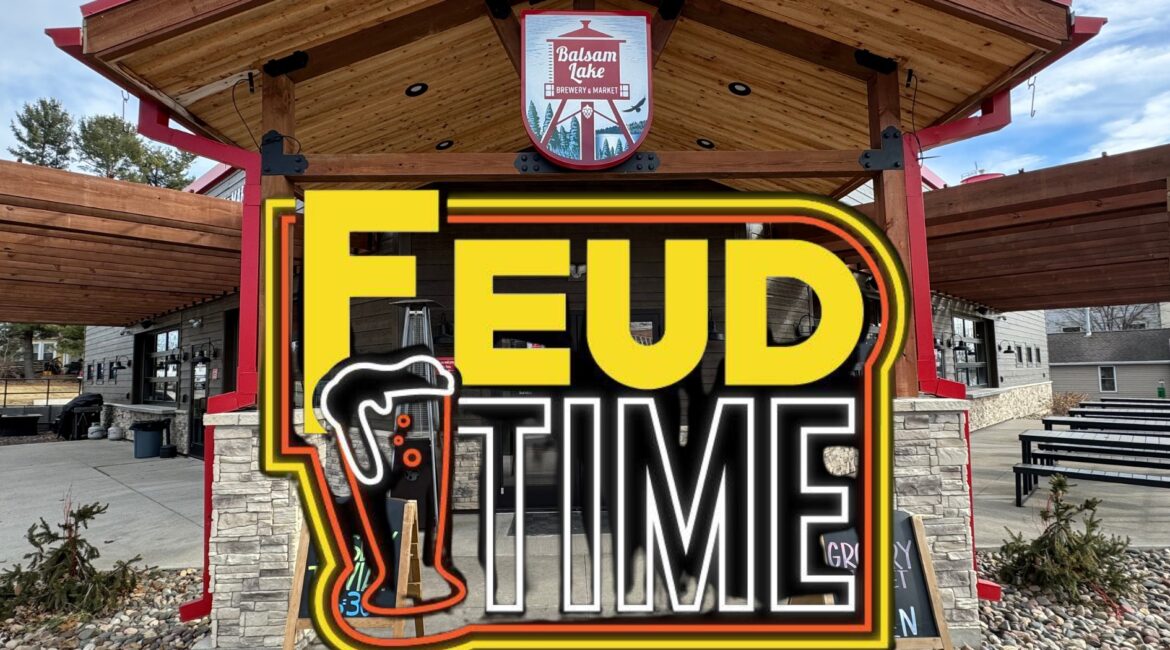 Image of an outdoor venue with a large sign saying "FEUD TIME" and "Tonight at 6:30 PM" displayed prominently. The venue has a wooden roof and stone accents.