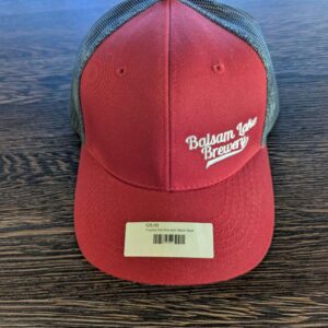 Trucker Hat Red with Black Back featuring "Balsam Lake Brewery" text and priced at $25.00, complete with a black mesh back.