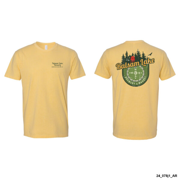 Front and back views of the Banana Cream Tee w/ Compass, a yellow T-shirt featuring a small logo on the front left chest and a larger graphic on the back showcasing trees, a compass design, and the text "Balsam Lake.