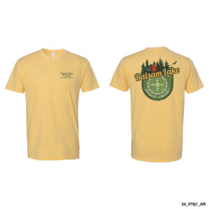 Front and back views of the Banana Cream Tee w/ Compass, a yellow T-shirt featuring a small logo on the front left chest and a larger graphic on the back showcasing trees, a compass design, and the text "Balsam Lake.