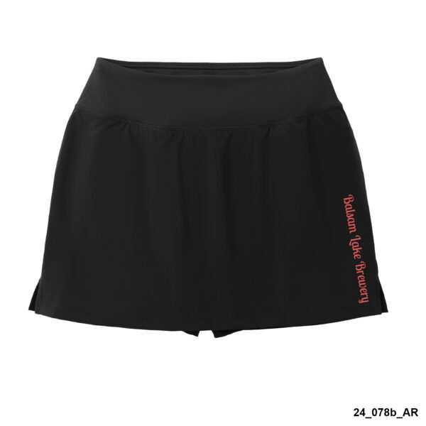 A women's skort in black featuring the "Badass Babe Brewery" logo printed vertically in red along the left side.