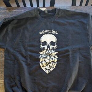 Black Crewneck Sweatshirt Skull showcasing a graphic skull with a leaf beard and the words "Balsam Lake Market & Brewery" above it.